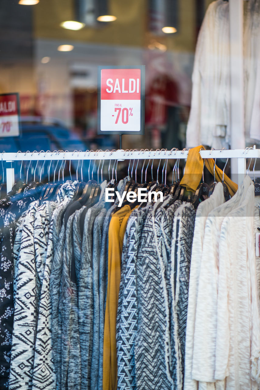 Clothes hanging on rack in store for sale