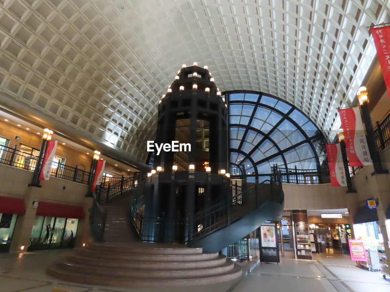 LOW ANGLE VIEW OF ILLUMINATED CEILING IN CITY