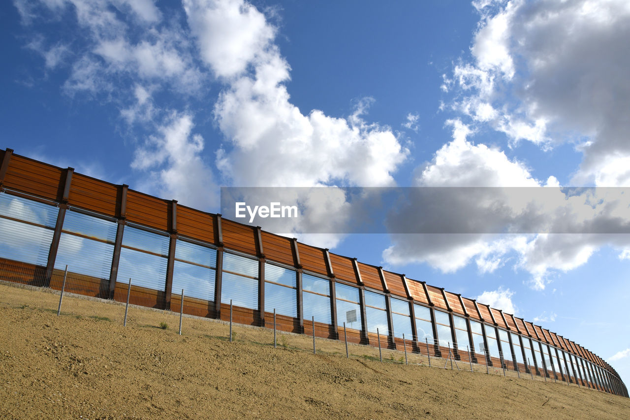 LOW ANGLE VIEW OF RAILING AGAINST SKY