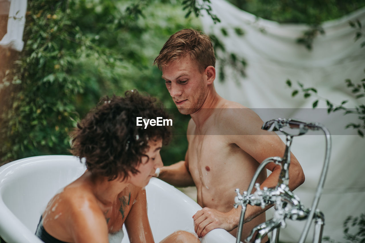 Young couple looking at camera