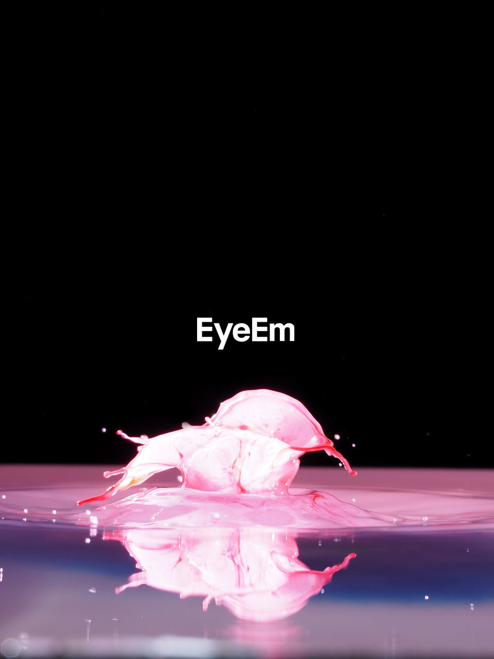 Close-up of water splashing against black background