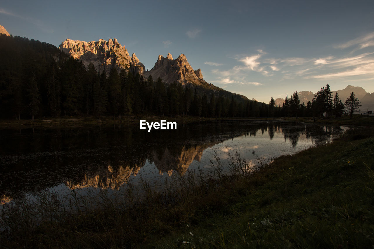 Reflection of trees in lake against sky