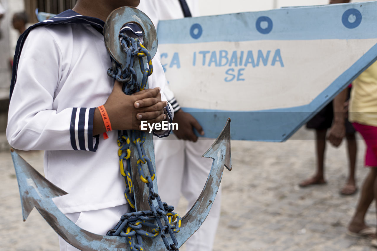 Men, women and children, members of the cultural group chegança dos marujos, 