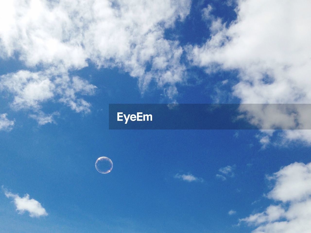 LOW ANGLE VIEW OF BLUE SKY AND MOON