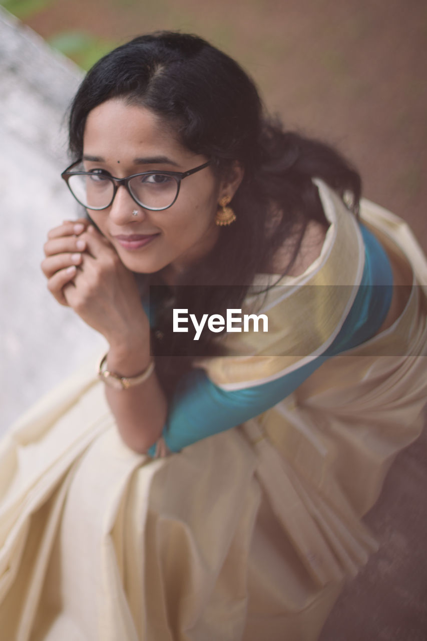 High angle portrait of a young woman taken during the onam festival.