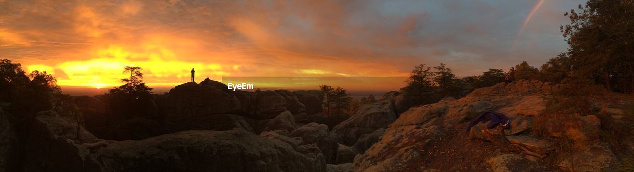 Scenic view of landscape against dramatic sky