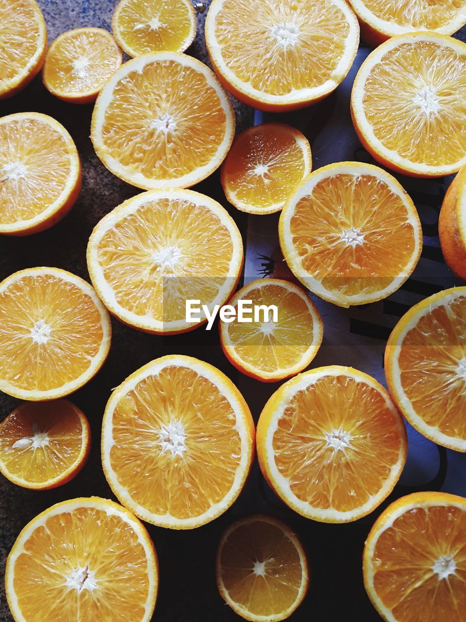 Full frame shot of oranges on table