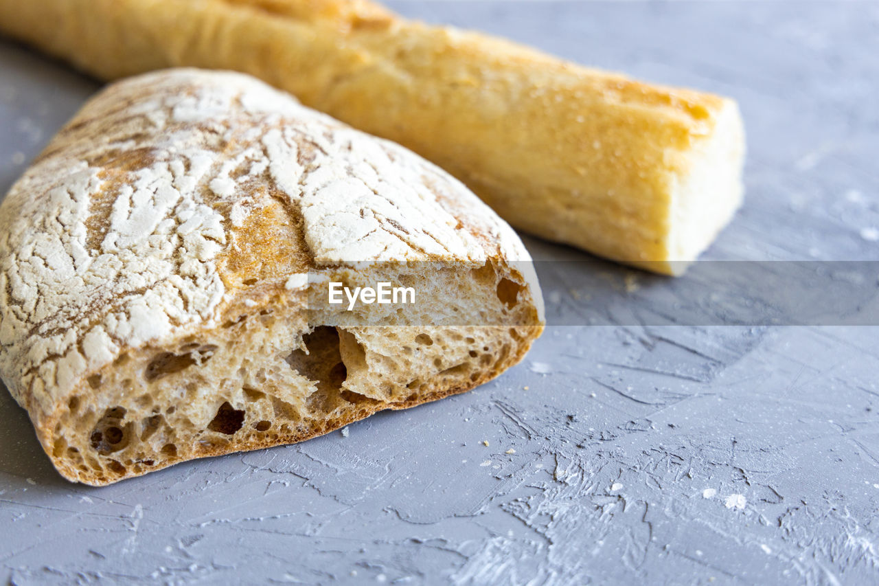 Close-up of bread on table. grey background,  space for text