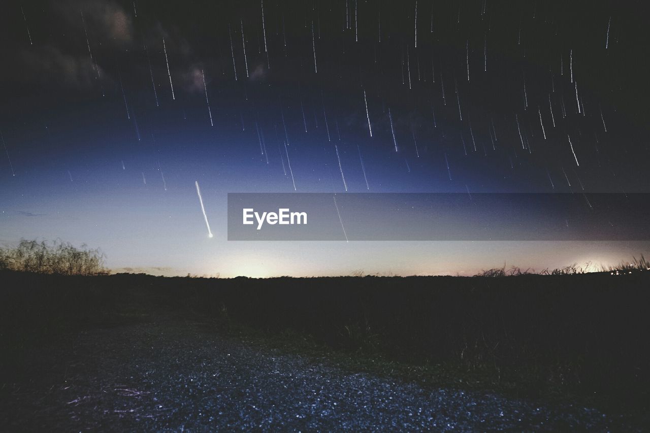 Scenic view of star field against sky at night