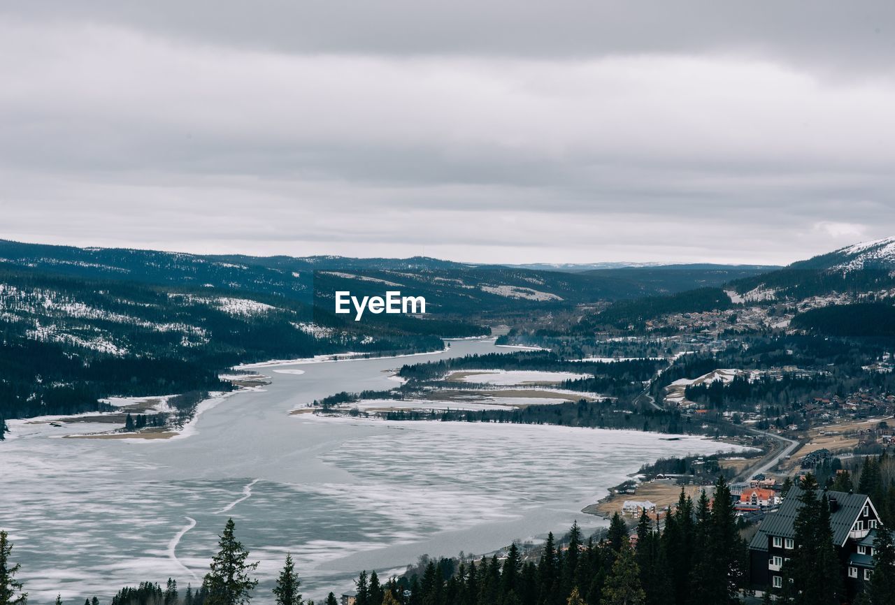 View over a snow covered lake and mountains in are northern sweden