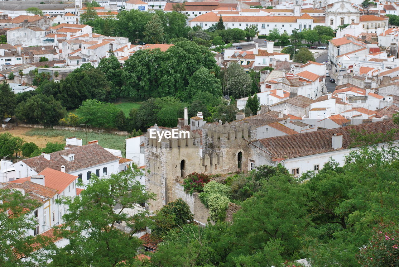 HIGH ANGLE VIEW OF HOUSES IN CITY