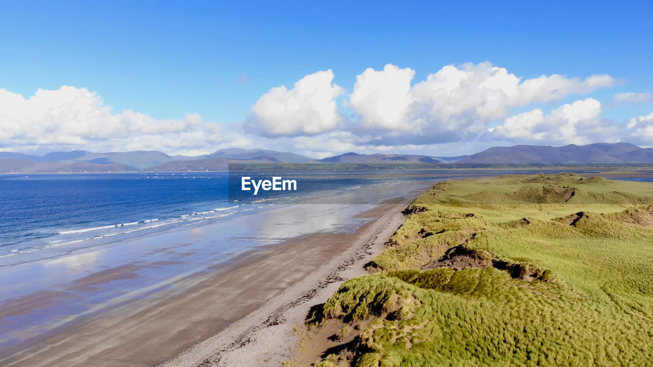 PANORAMIC VIEW OF SEA AND MOUNTAINS AGAINST SKY