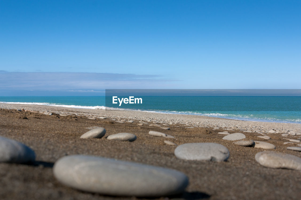 SCENIC VIEW OF BEACH AGAINST CLEAR SKY