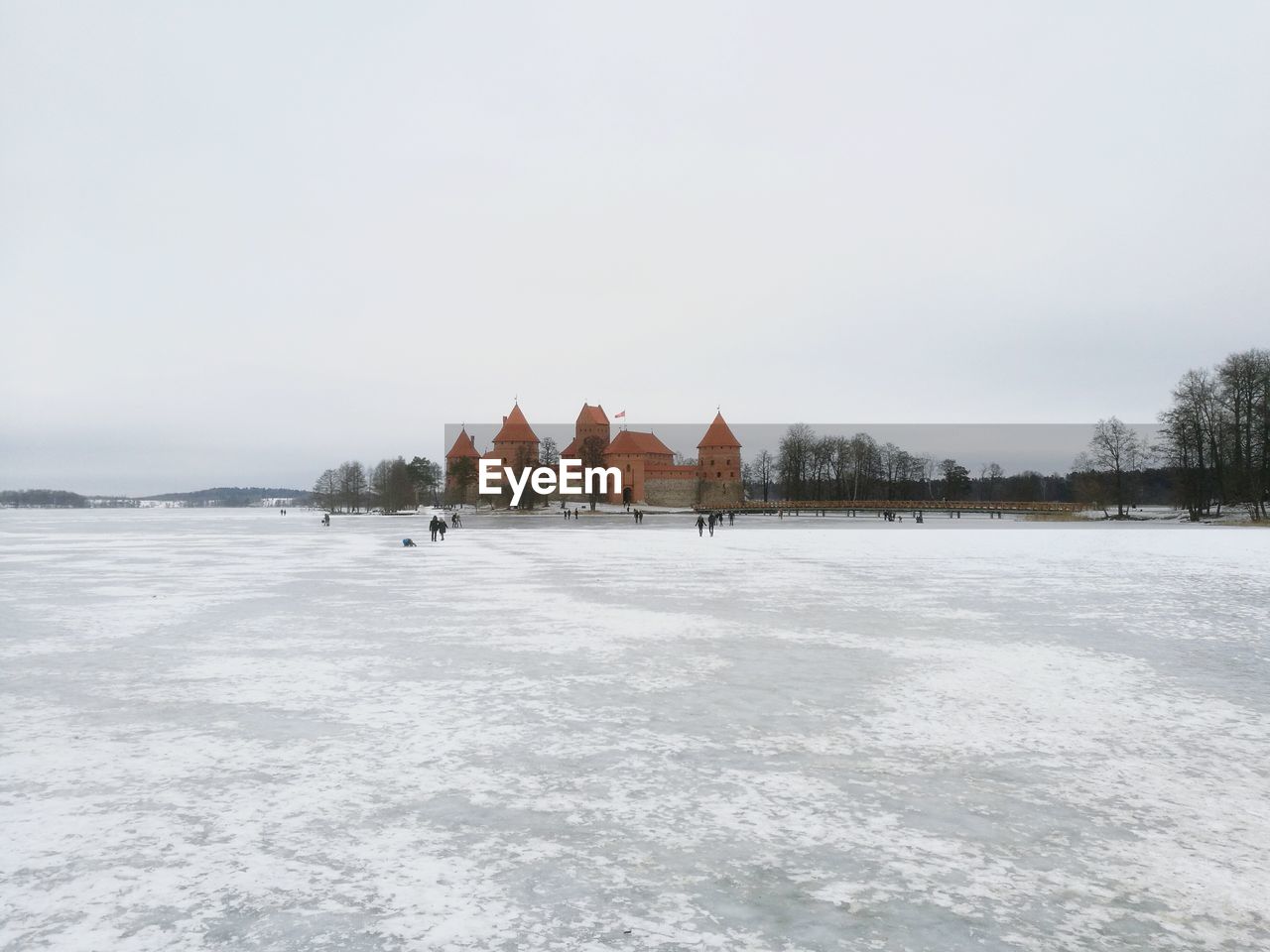 Snow covered landscape against sky