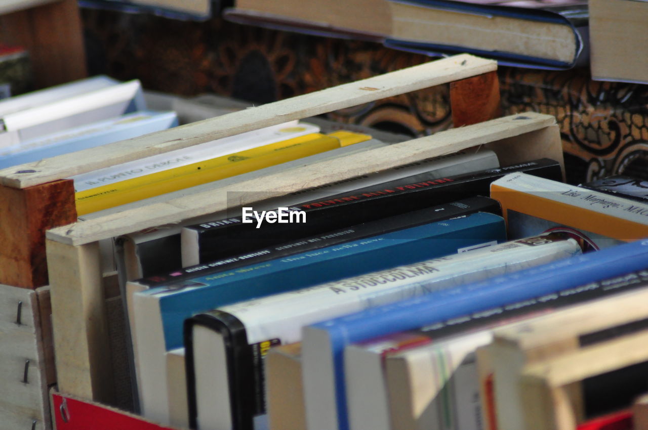 art, book, large group of objects, indoors, no people, shelf, publication, business, selective focus, wood, document, education, file, abundance