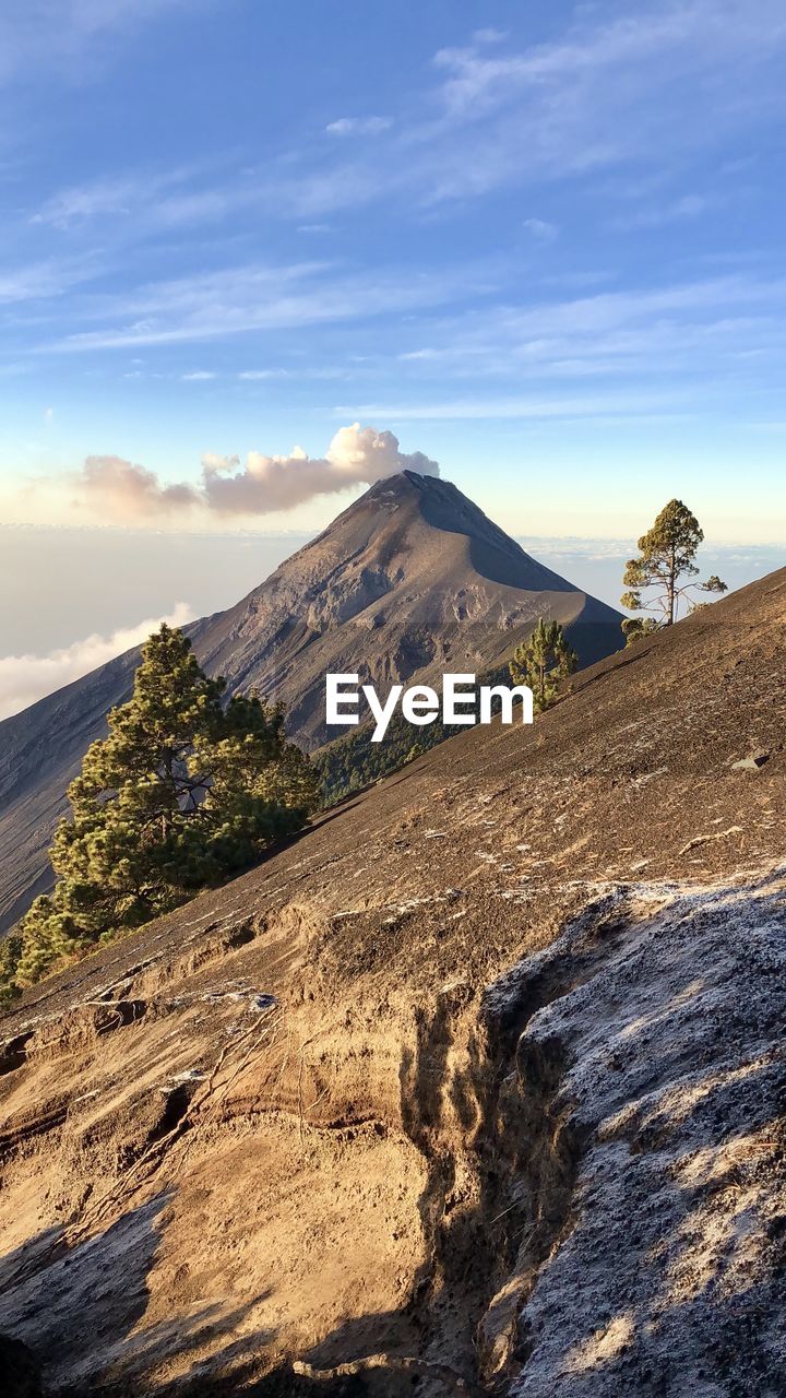 SCENIC VIEW OF LANDSCAPE AND MOUNTAINS AGAINST SKY