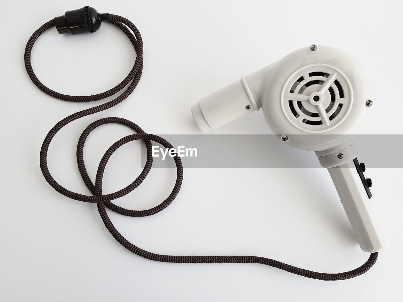 High angle view of hair dryer on white background