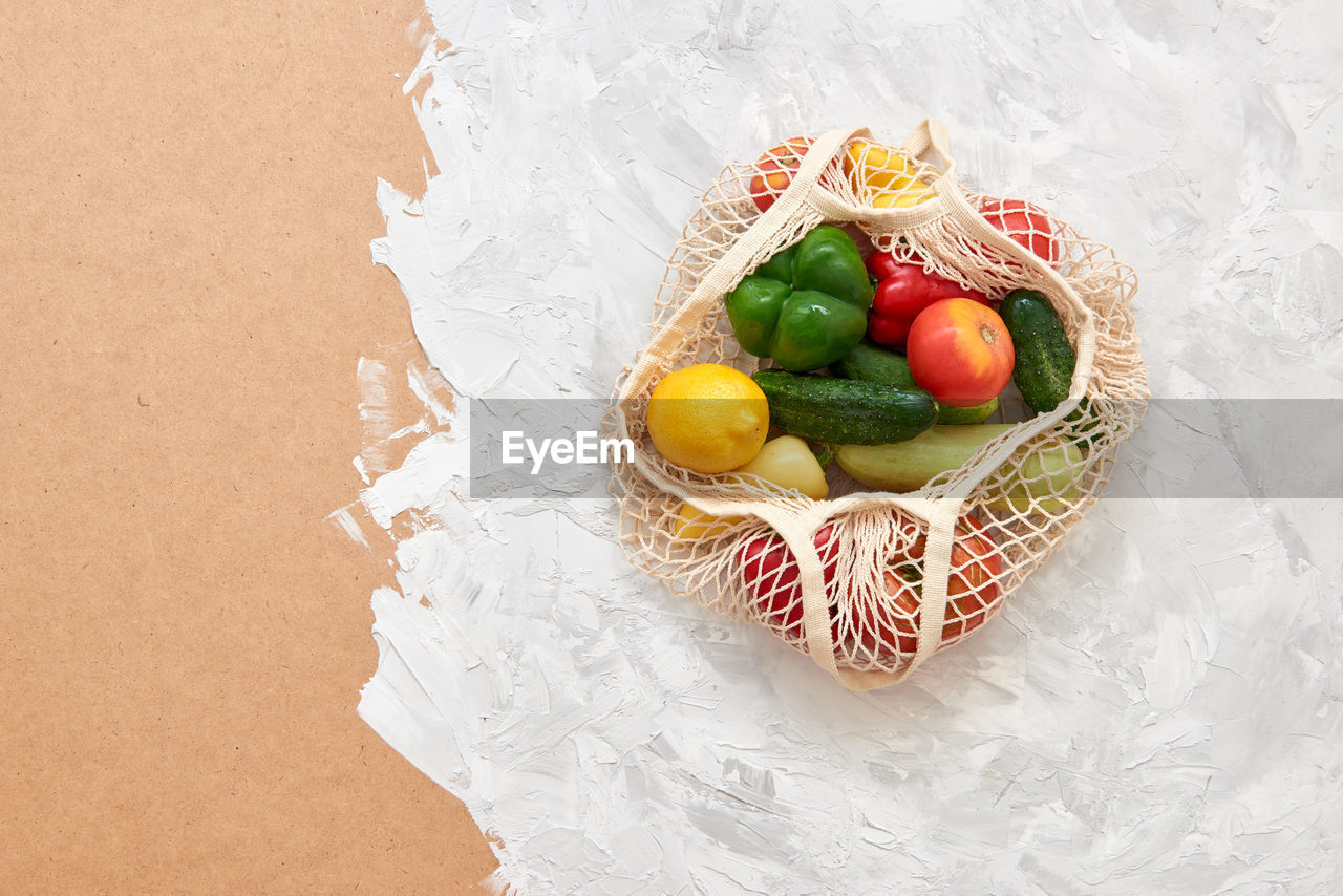 HIGH ANGLE VIEW OF STRAWBERRIES IN BASKET