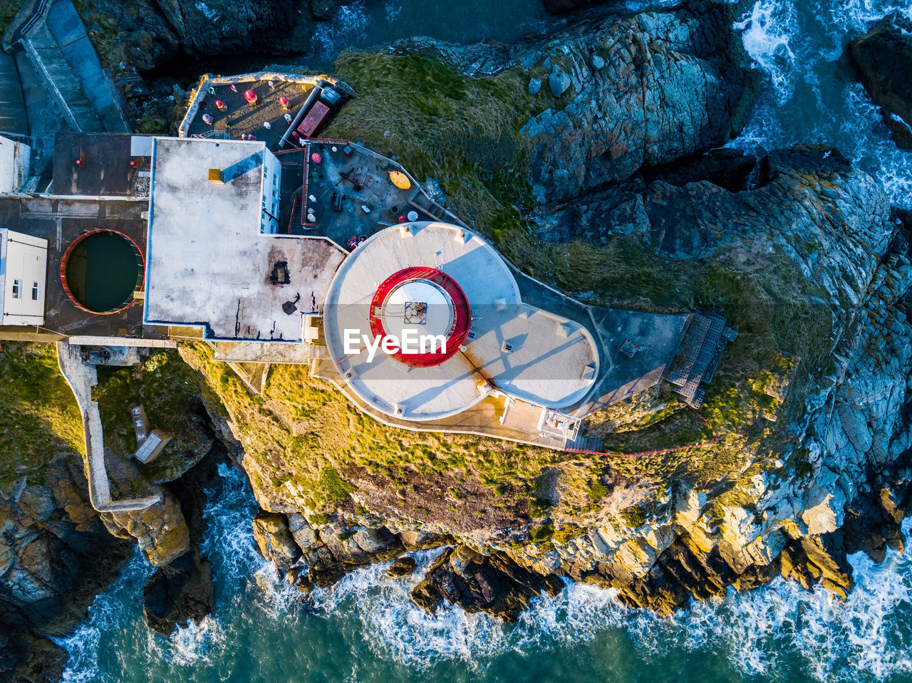 High angle view of lighthouse by sea