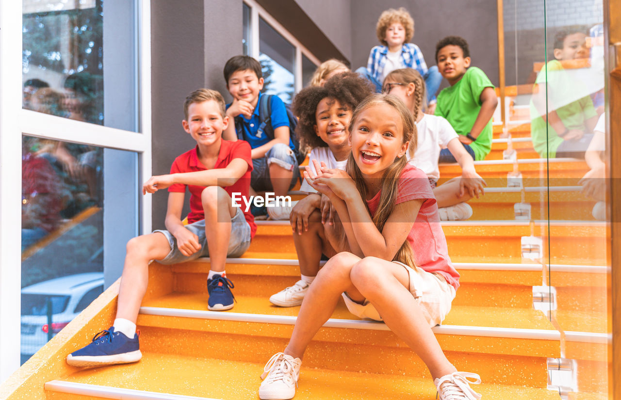 Friends sitting on staircase