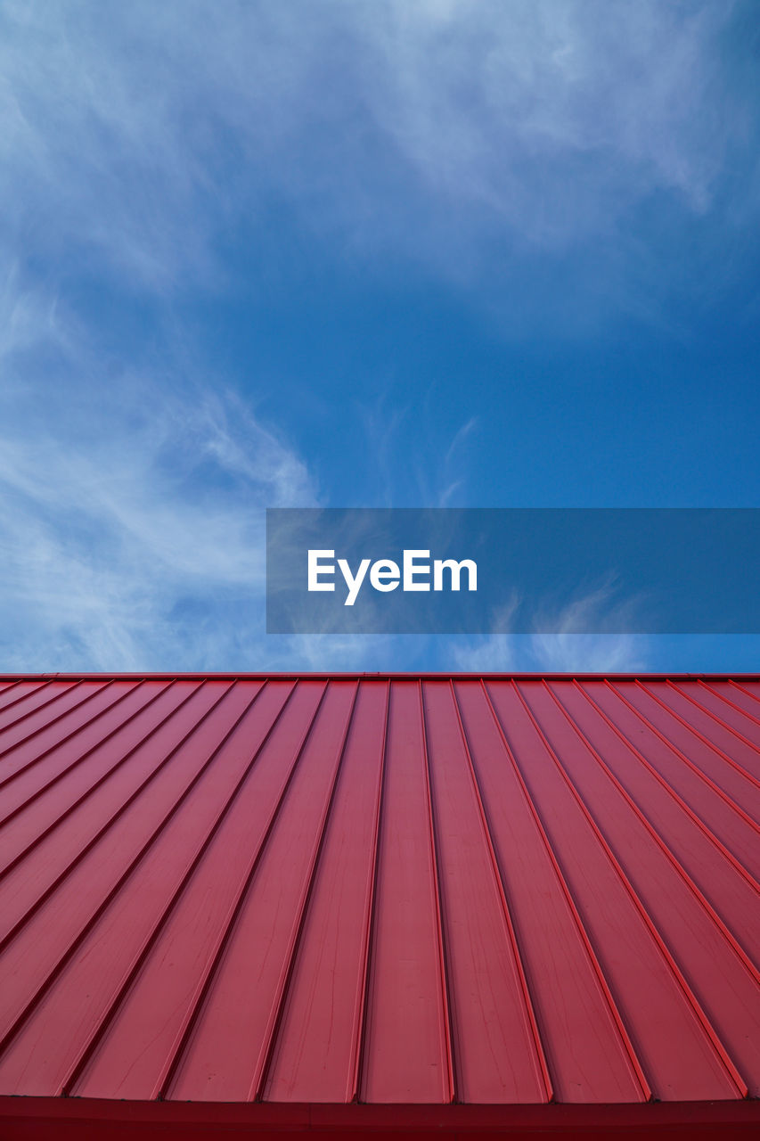 Red roof against sky