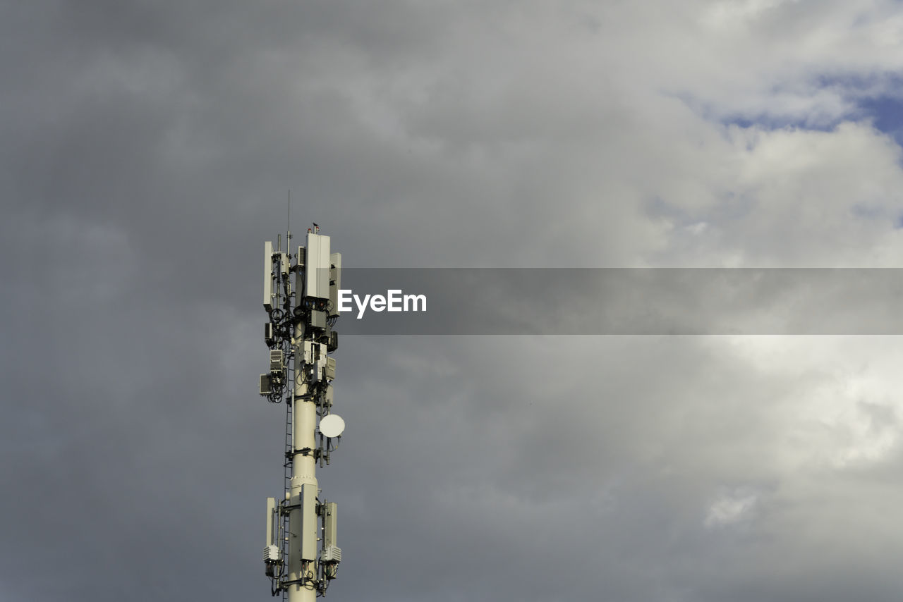 LOW ANGLE VIEW OF TELEPHONE POLE AGAINST SKY