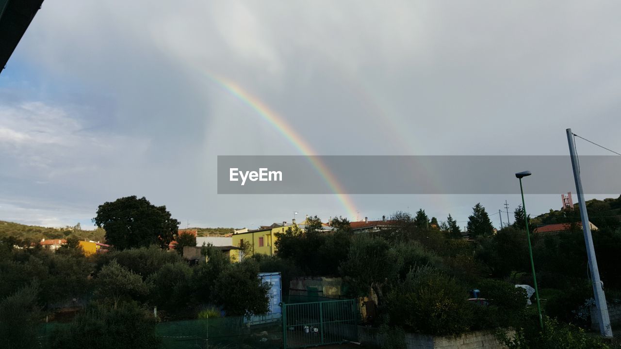 LOW ANGLE VIEW OF RAINBOW IN SKY