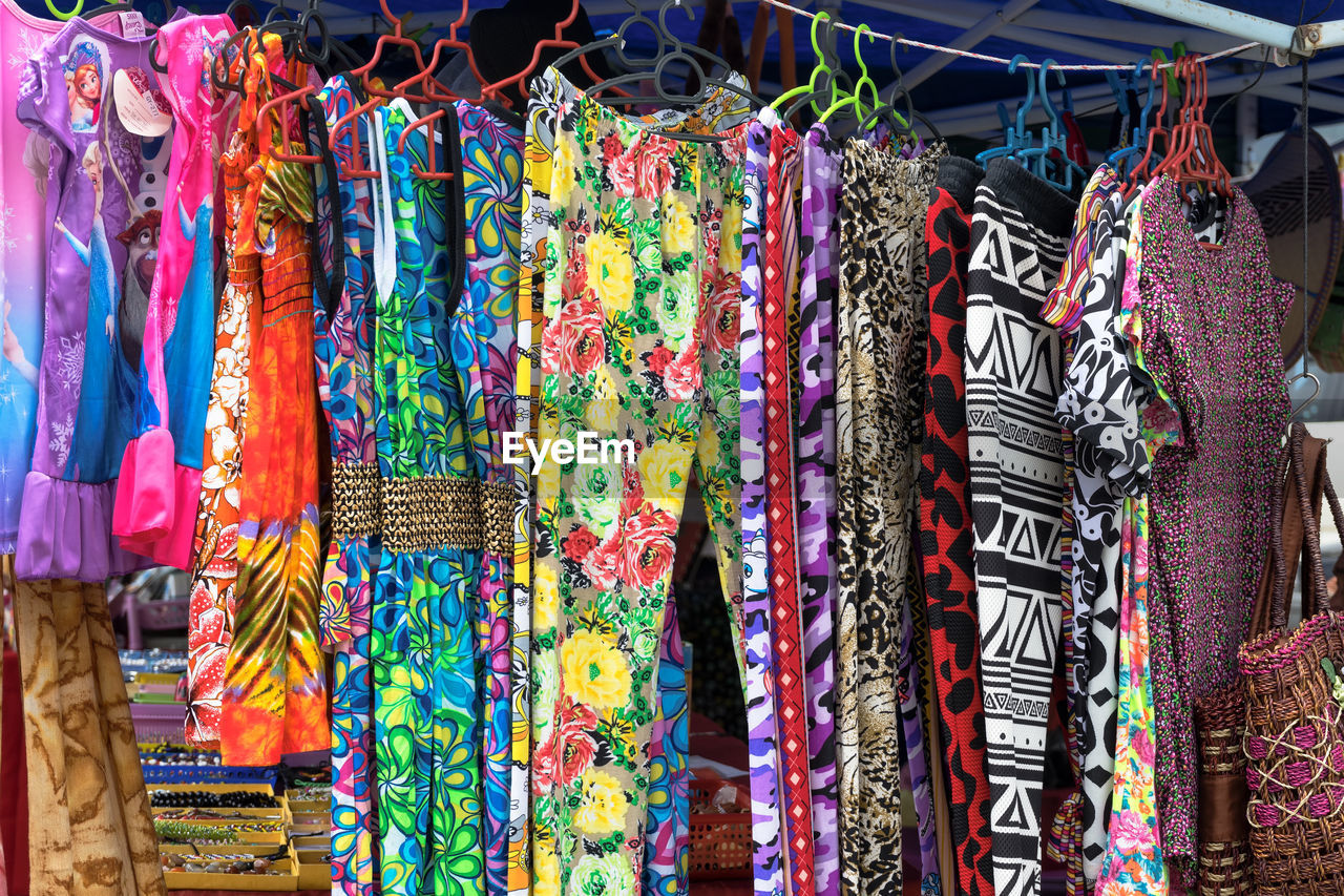 Close-up of colorful clothes hanging at market stall