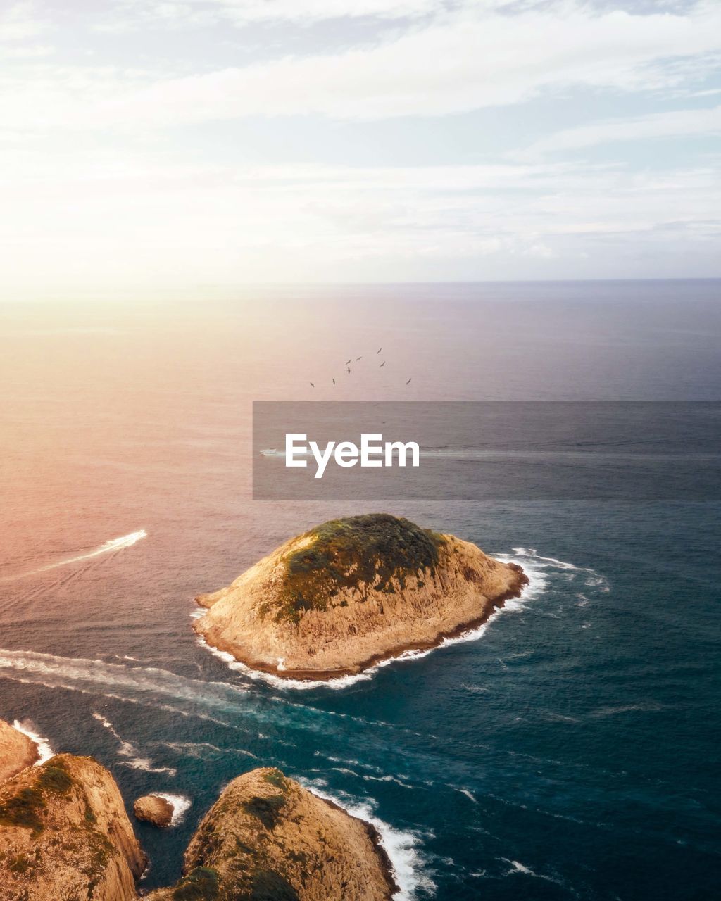 high angle view of sea against sky during sunset