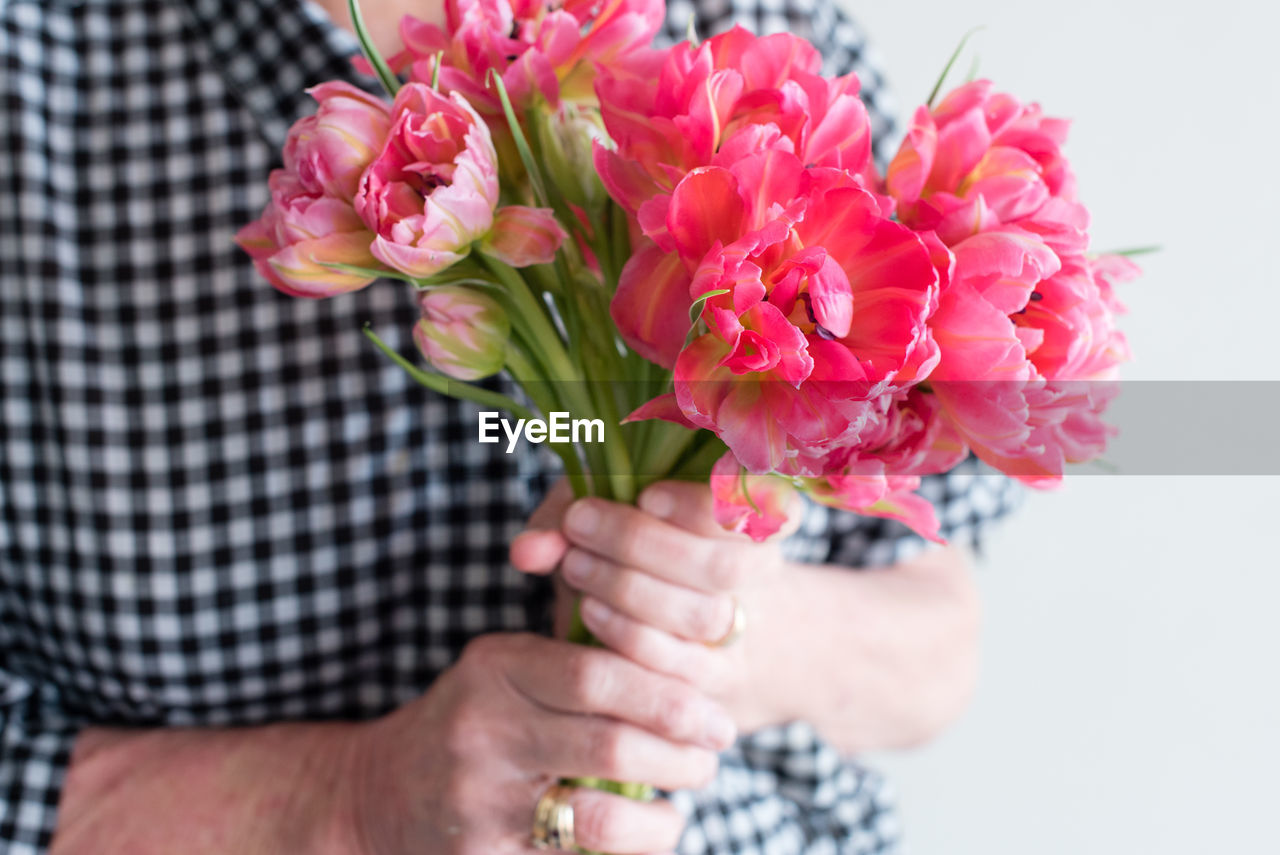 Close-up of hand holding bouquet