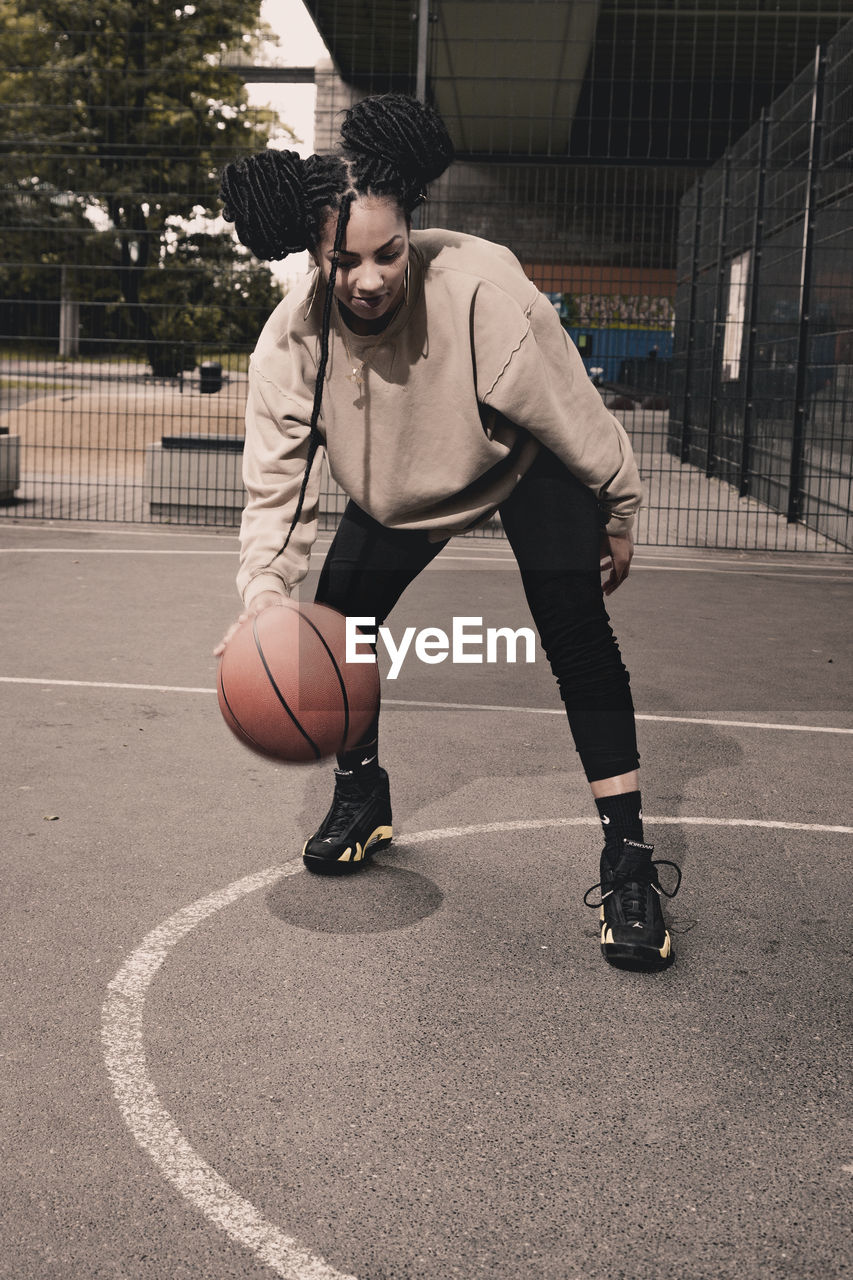 Woman playing basketball