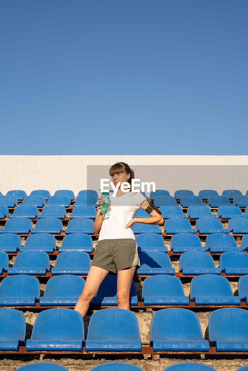 Healthy lifestyle concept. teenage doing sports alone at the empty stadium