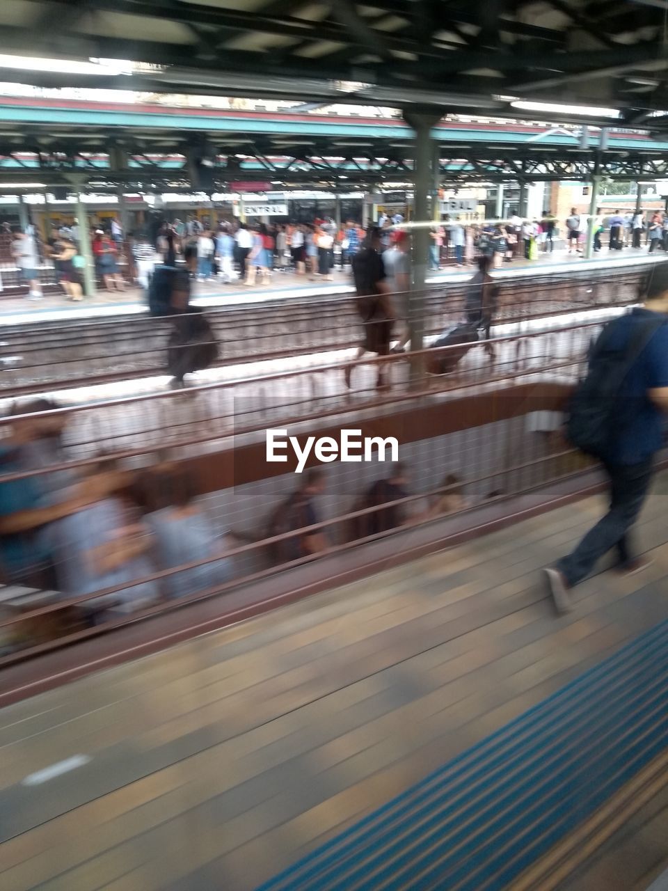 GROUP OF PEOPLE AT RAILROAD STATION PLATFORM