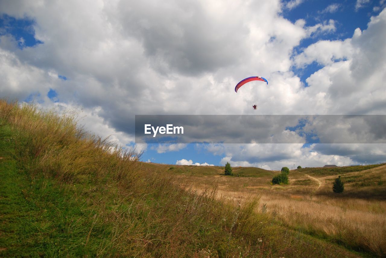 Paragliding over field