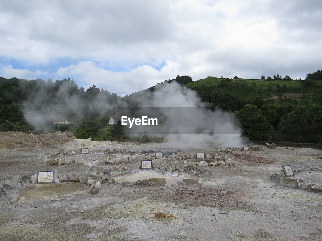 environment, landscape, geology, cloud, steam, smoke, mountain, sky, heat, nature, physical geography, scenics - nature, non-urban scene, beauty in nature, hot spring, travel, land, no people, travel destinations, social issues, outdoors, power in nature, tourism, day, water, volcano, volcanic landscape, geyser, tree, accidents and disasters, plant, body of water