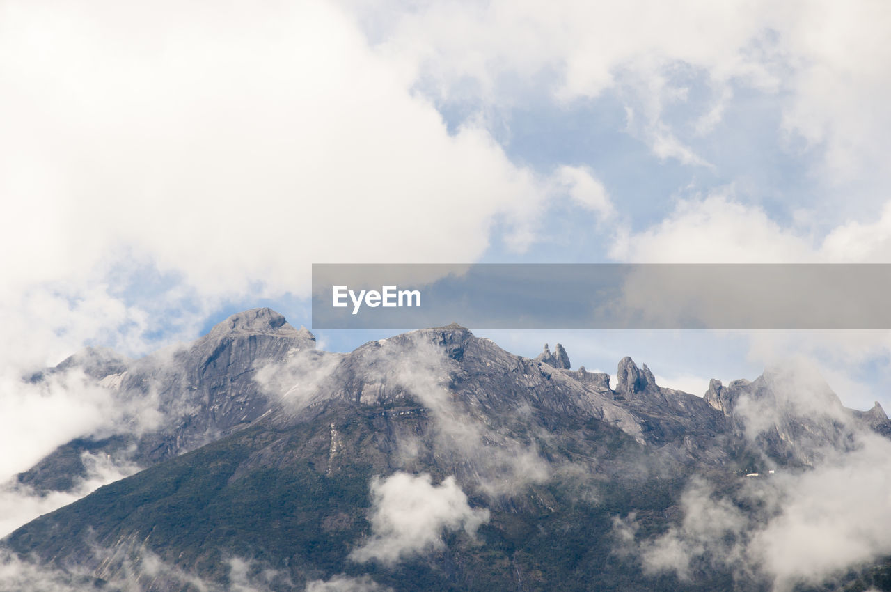 PANORAMIC VIEW OF VOLCANIC LANDSCAPE AGAINST SKY