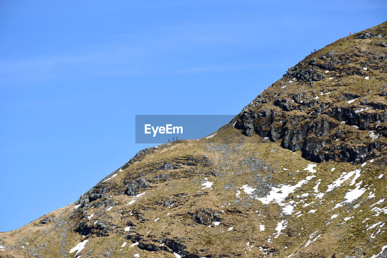 Low angle view of ben lomond mountain against blue sky