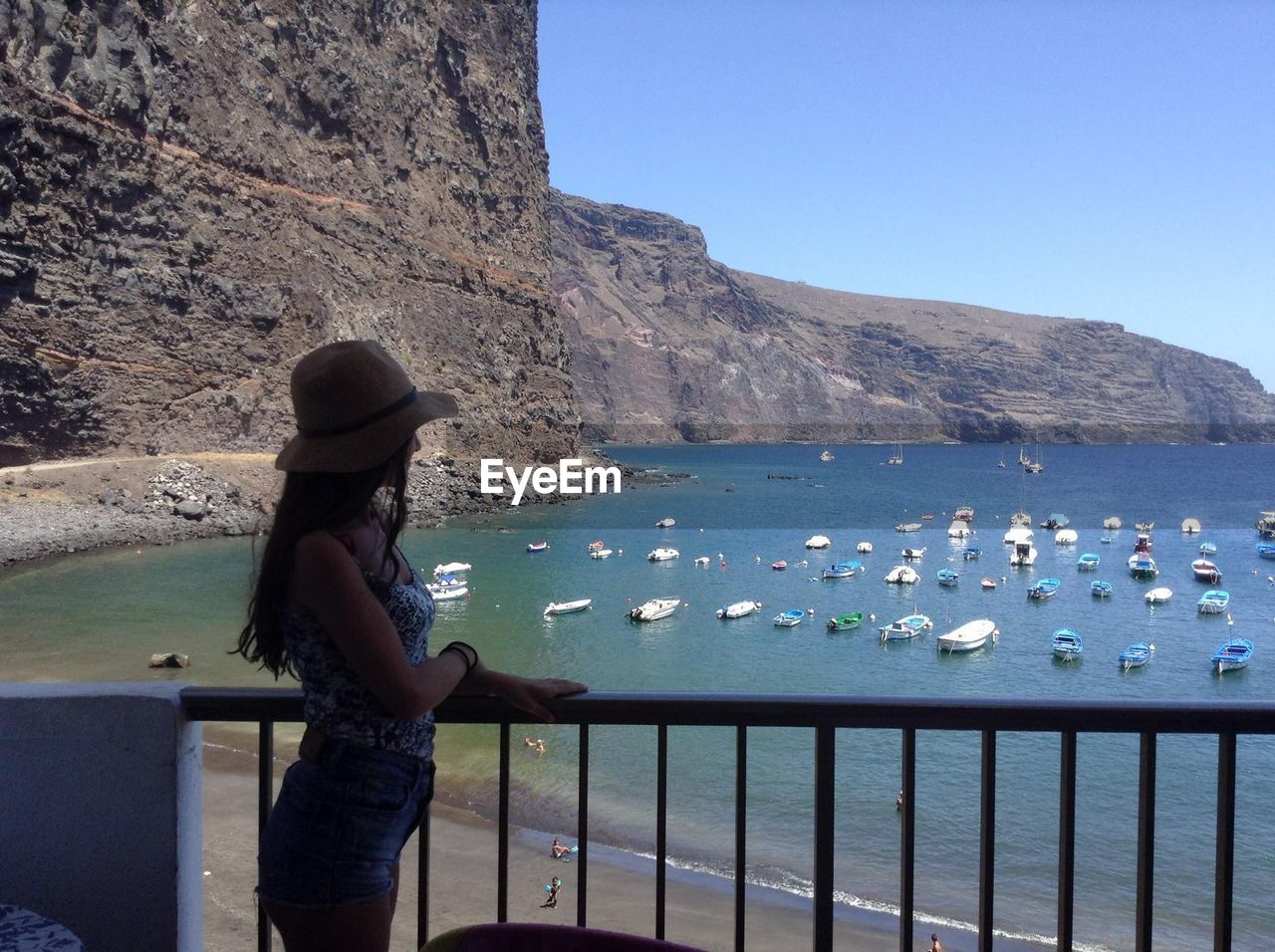 WOMAN LOOKING AT SEA