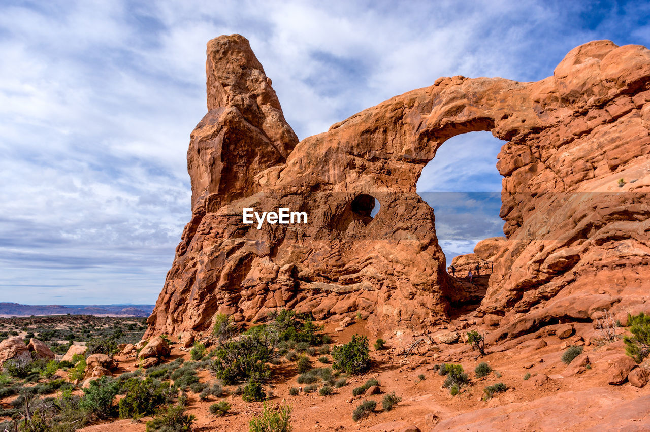 Low angle view of rock formation against sky