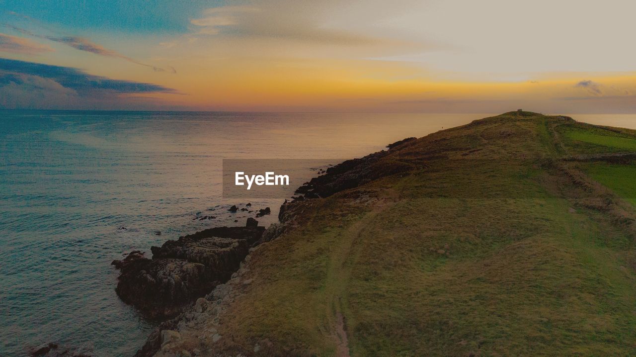 Scenic view of sea against sky during sunset