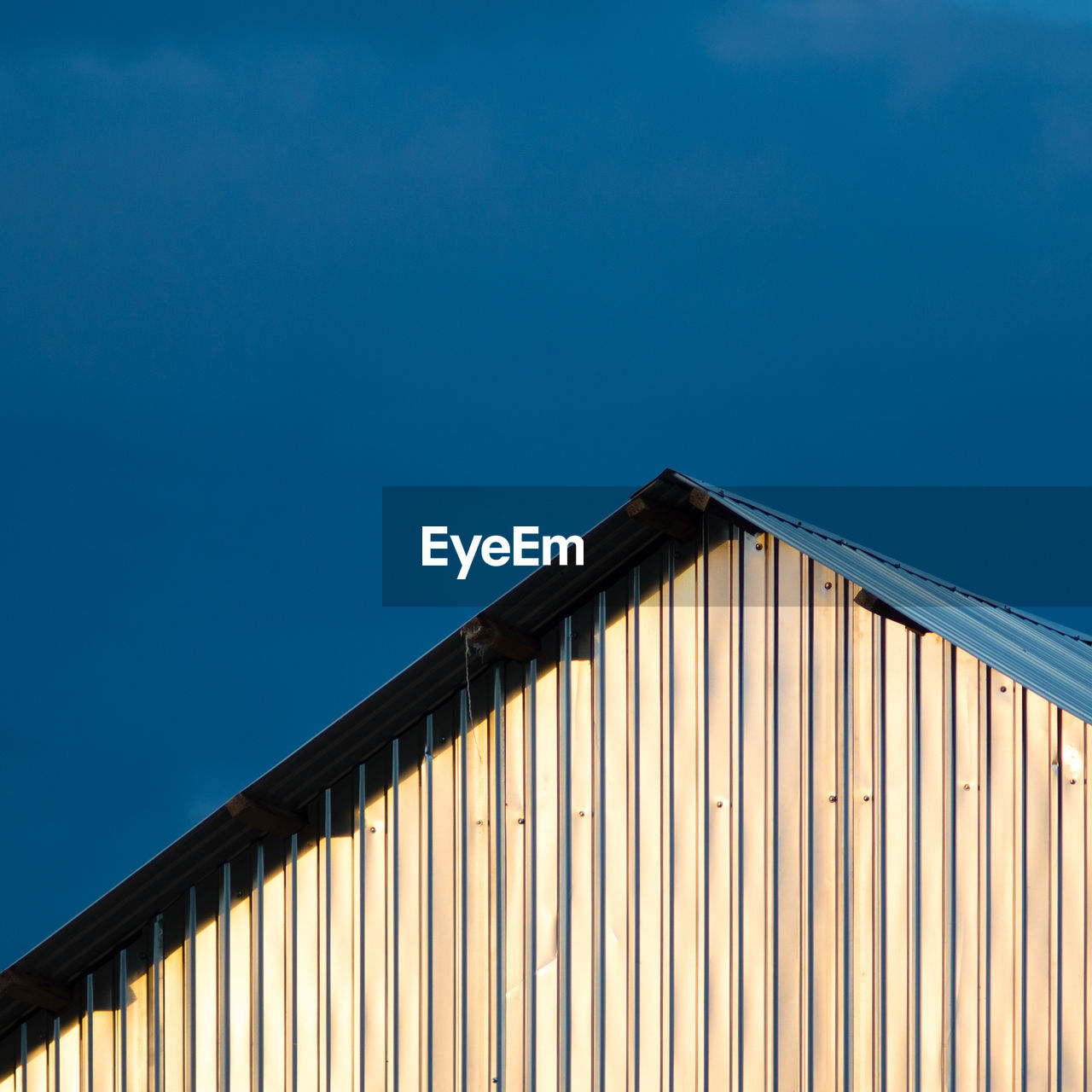 Low angle view of built structure against blue sky