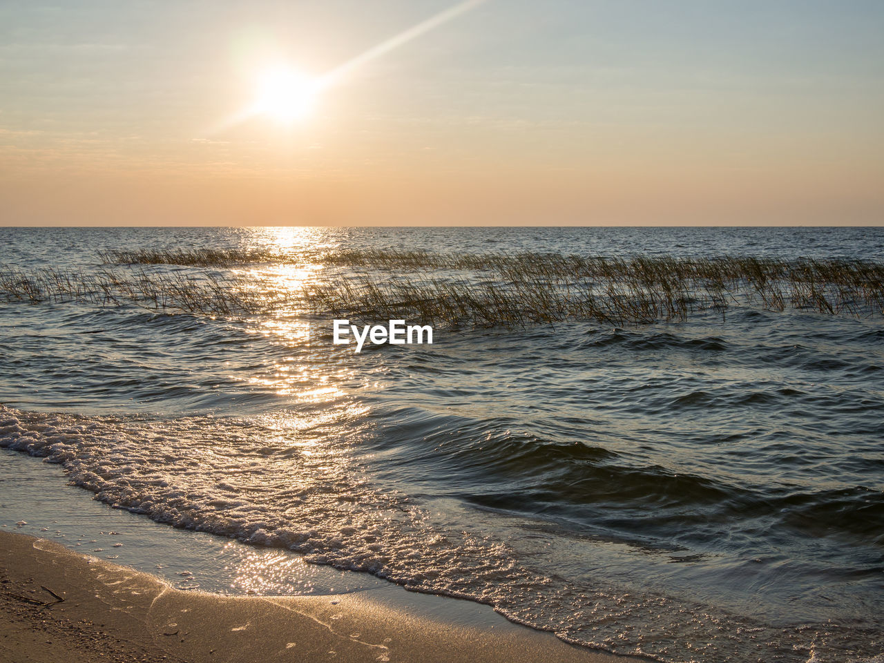 Scenic view of sea against sky during sunset