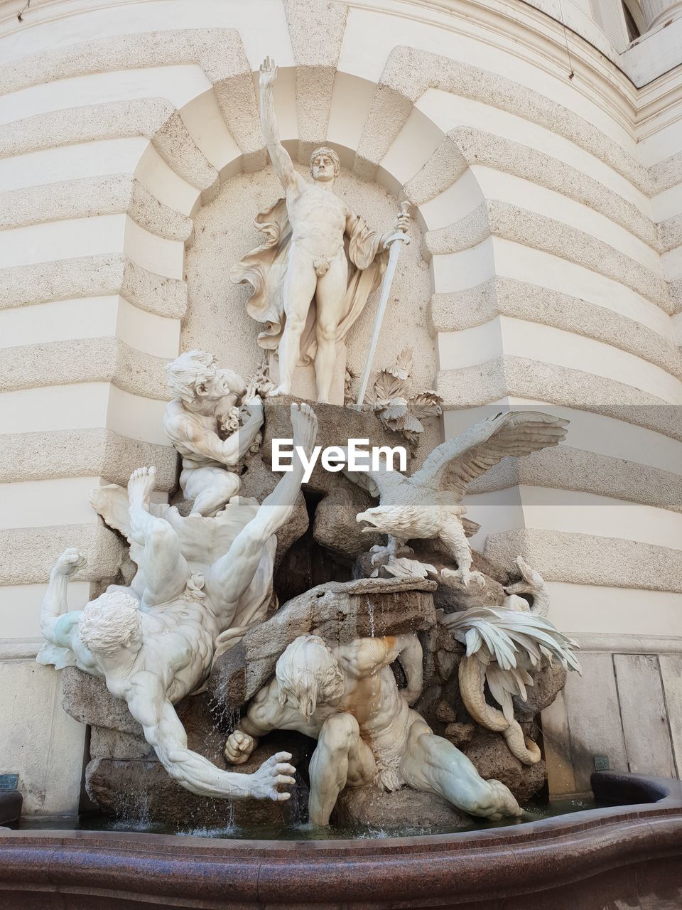 Low angle view of statue against building