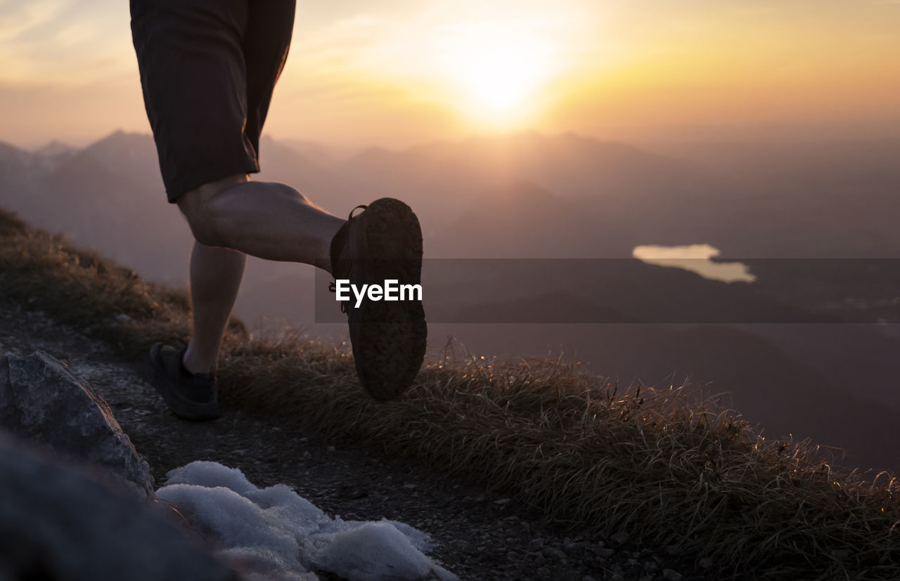 Hiker running on sauling mountain peak