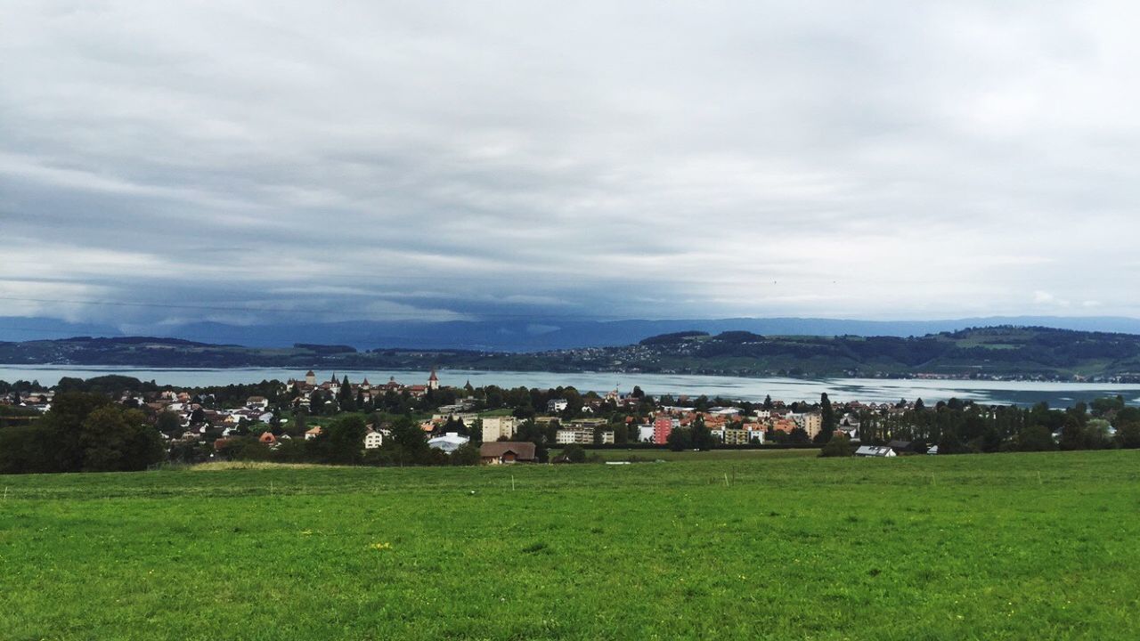 Scenic view of landscape and mountains against sky