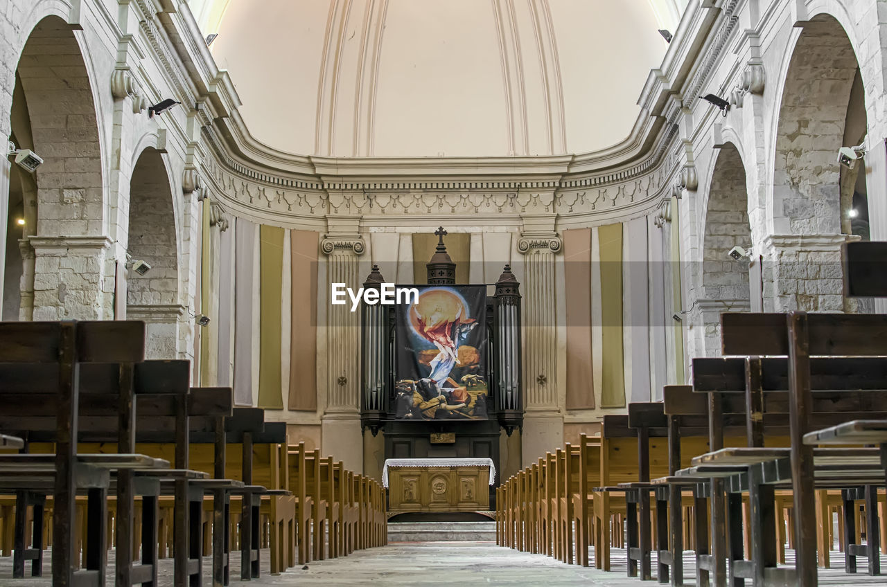 Surface level of benches in row at church