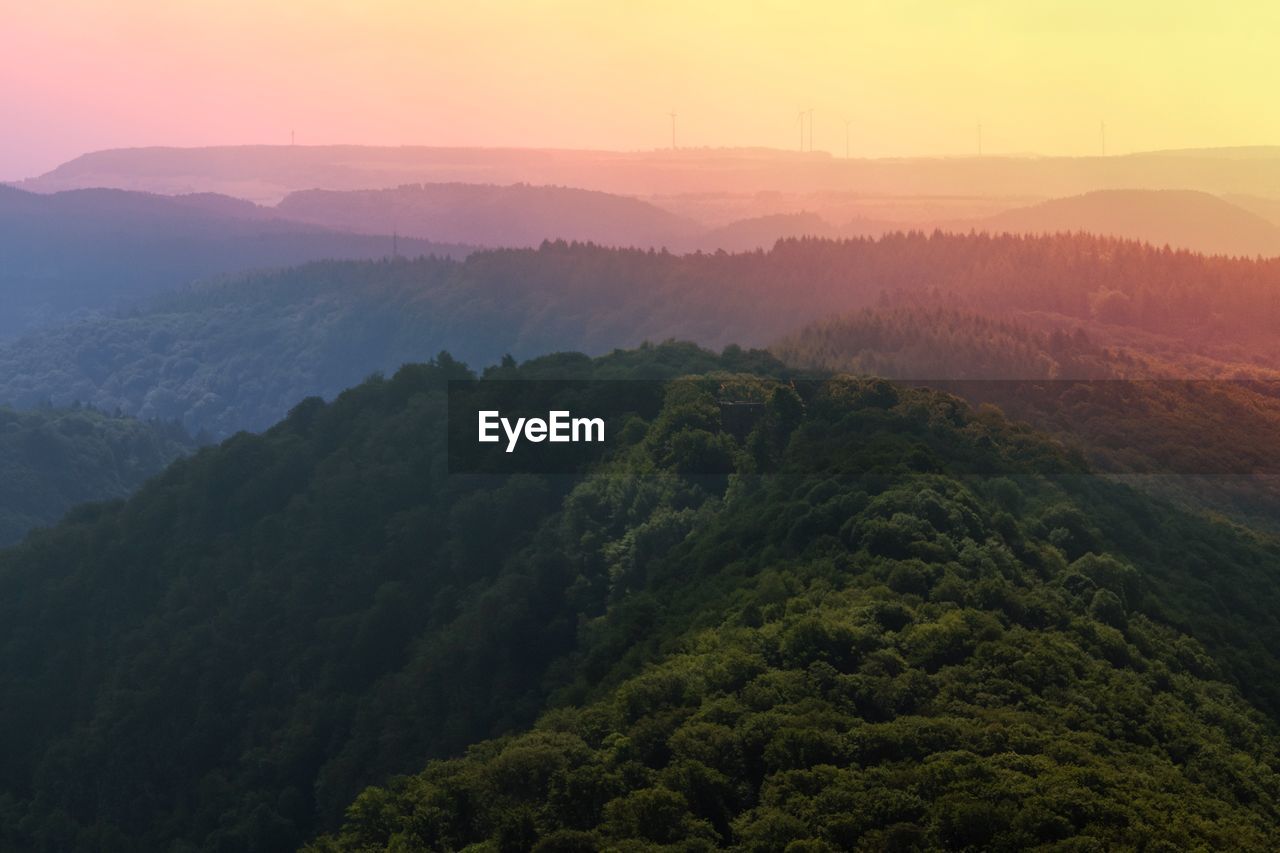 Scenic view of mountains against sky during sunset
