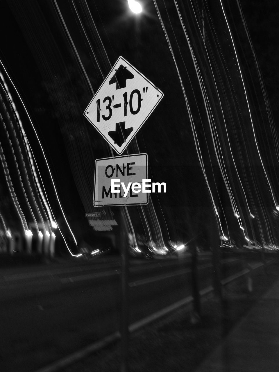 sign, communication, road, transportation, road sign, darkness, light, text, guidance, night, black, black and white, western script, no people, illuminated, symbol, monochrome, arrow symbol, monochrome photography, city, information sign, architecture, street, white, warning sign, low angle view, directional sign, outdoors