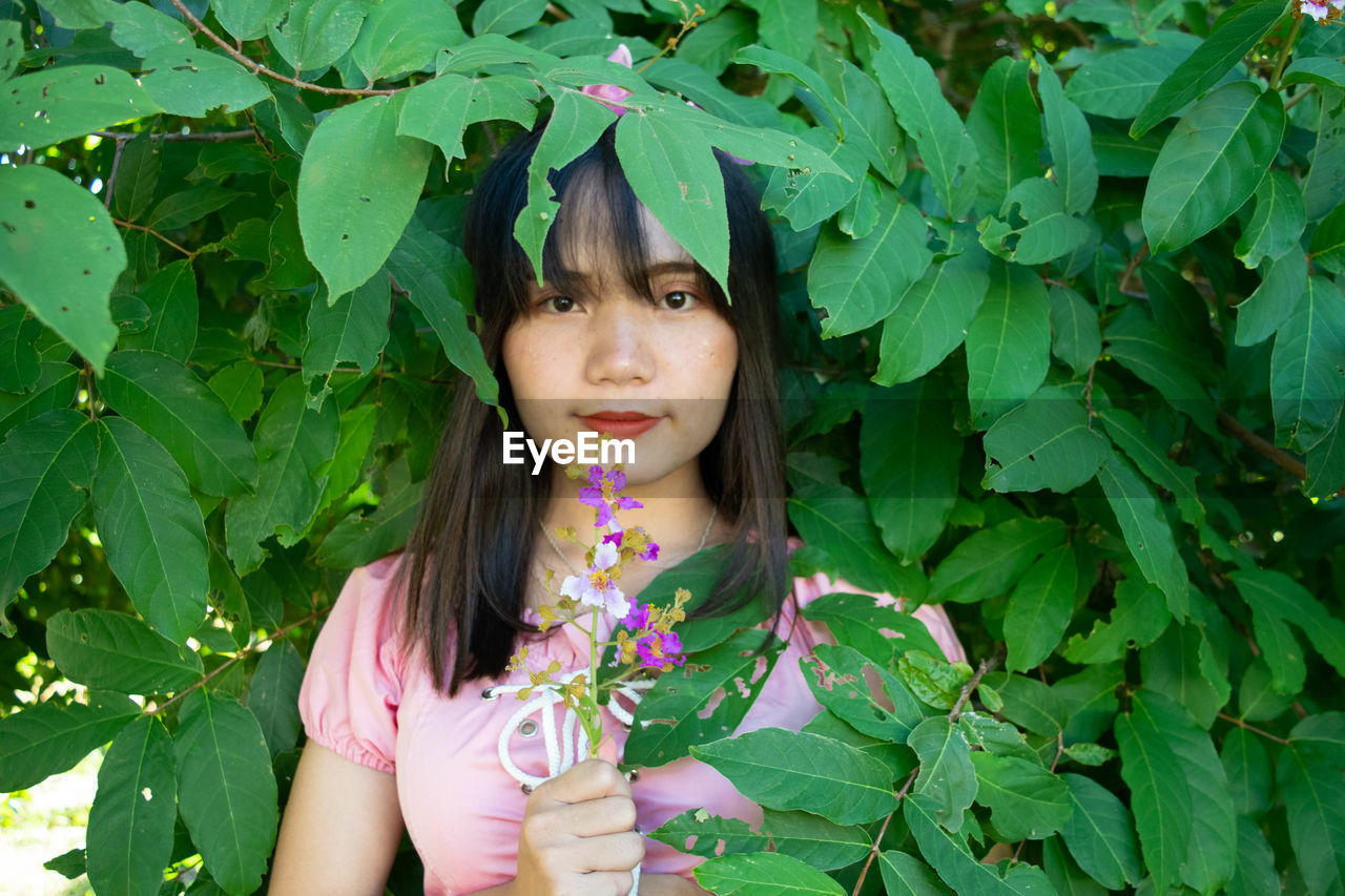 Portrait of woman in plant