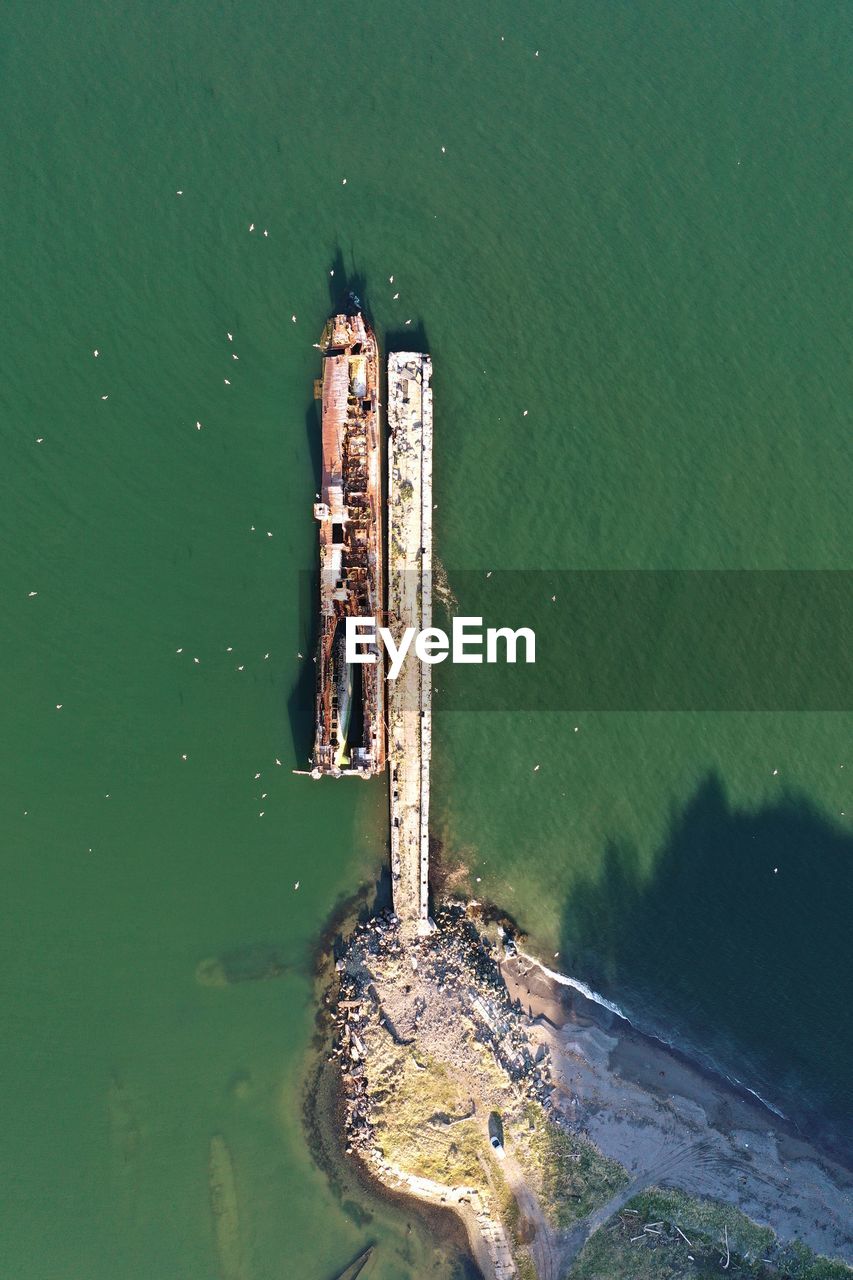 High angle view of wooden post in lake